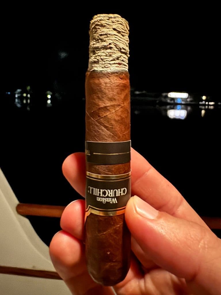 Davidoff Winston Churchill Late Hour Robusto mid-smoke with stacked ash at night