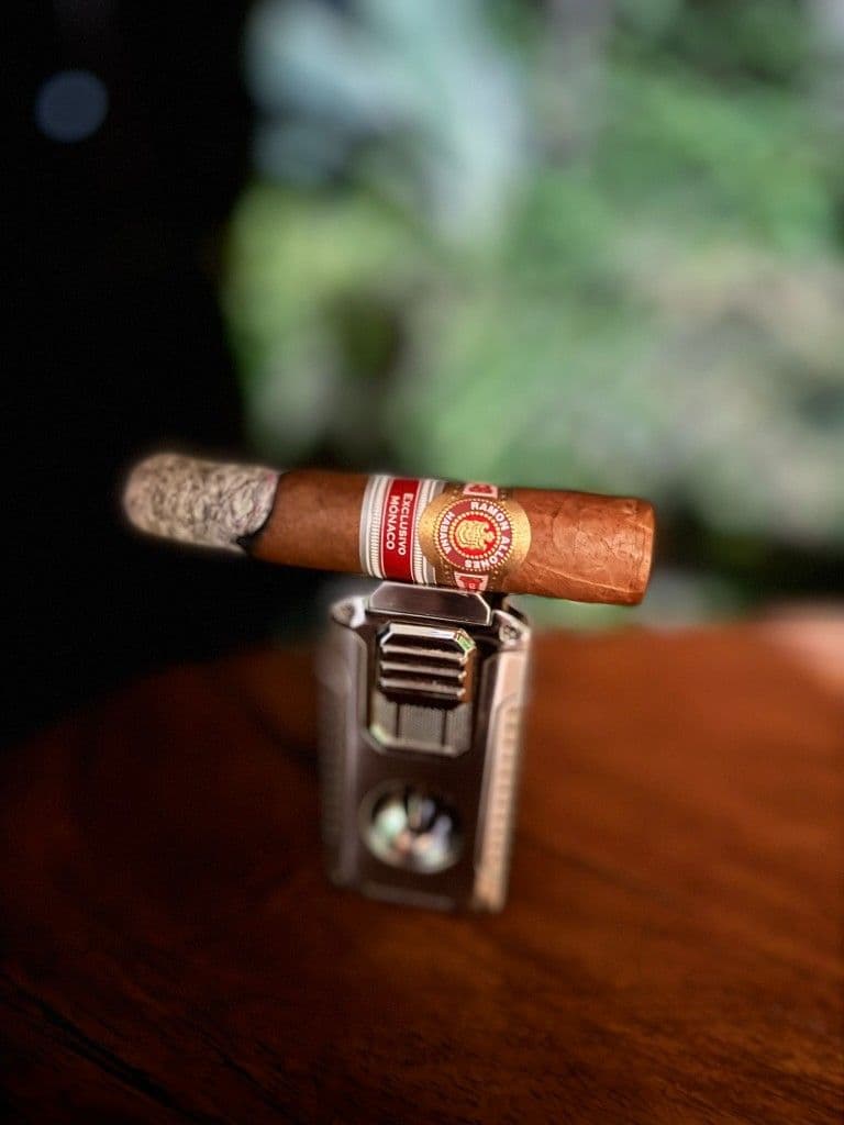 Ramon Allones Casino Monaco cigar with a long firm ash mid-smoke