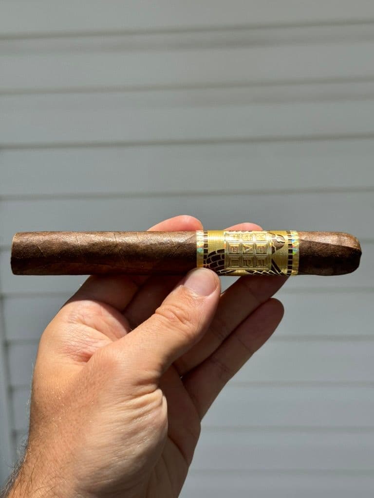Unlit Meerapfel Création Liberté held outdoors showing toothy Cameroon wrapper