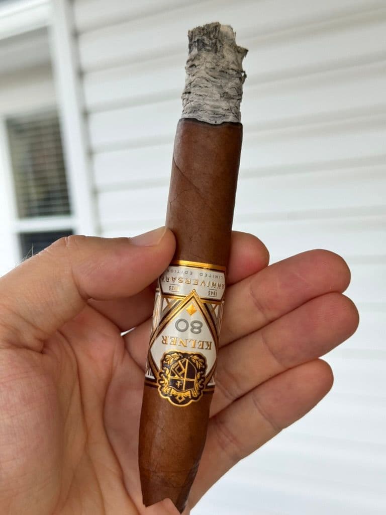 Kelner 80th Anniversary mid-smoke with stacked ash and main band