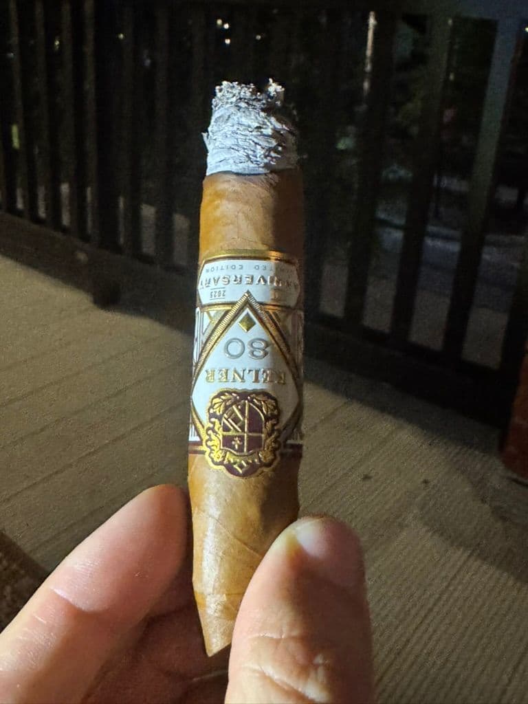 Kelner 80th Anniversary figurado taper held at night with ash tower